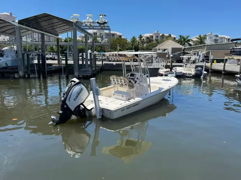 Slide: The Image of 2018 Key West 230 Bay Reef boat docked in marina. - 4