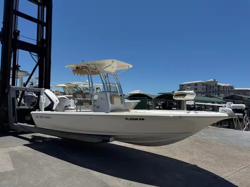 Slide: The Image of 2018 Key West 230 Bay Reef boat on a dock. - 7