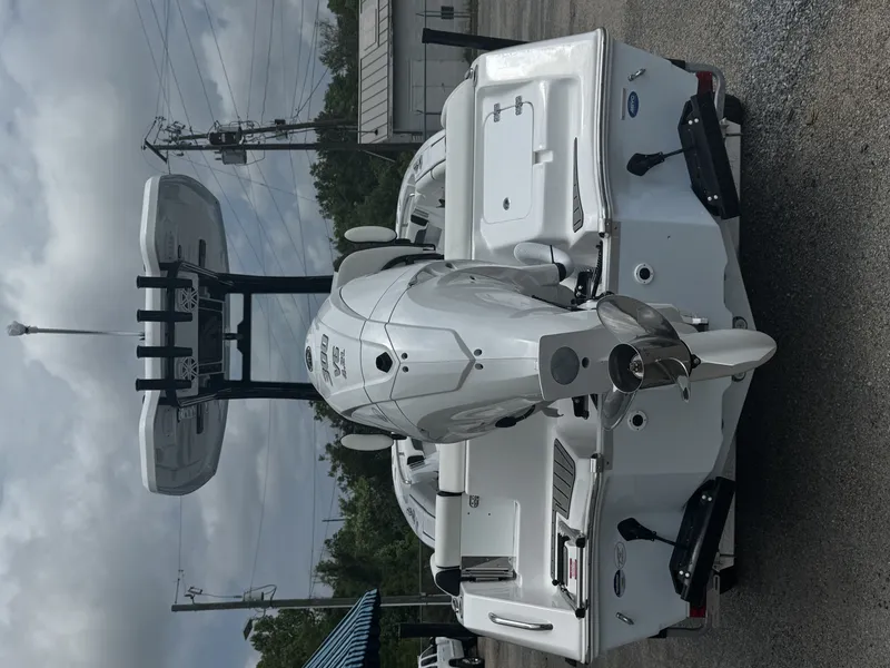 Slide: The Image of Rear view of 2026 Tidewater 232 LXF boat with outboard motor. - 21