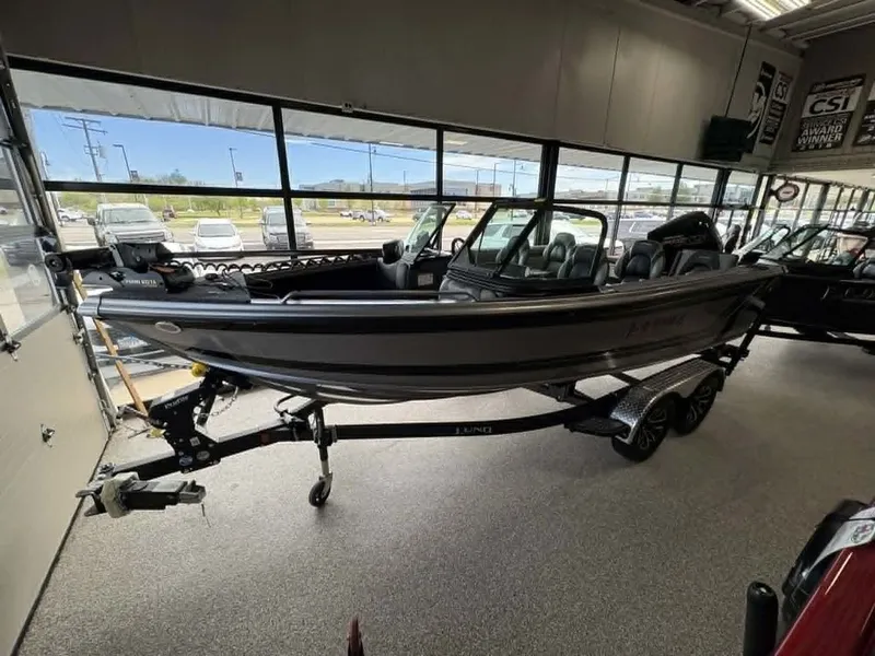 The Image of 2026 Lund 1875 Tyee Sport boat in showroom on trailer. - 1