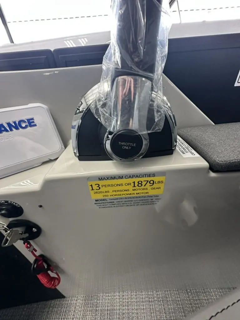 Slide: The Image of Crest Conquest 23 FT 2026 boat control with capacity sticker. - 10