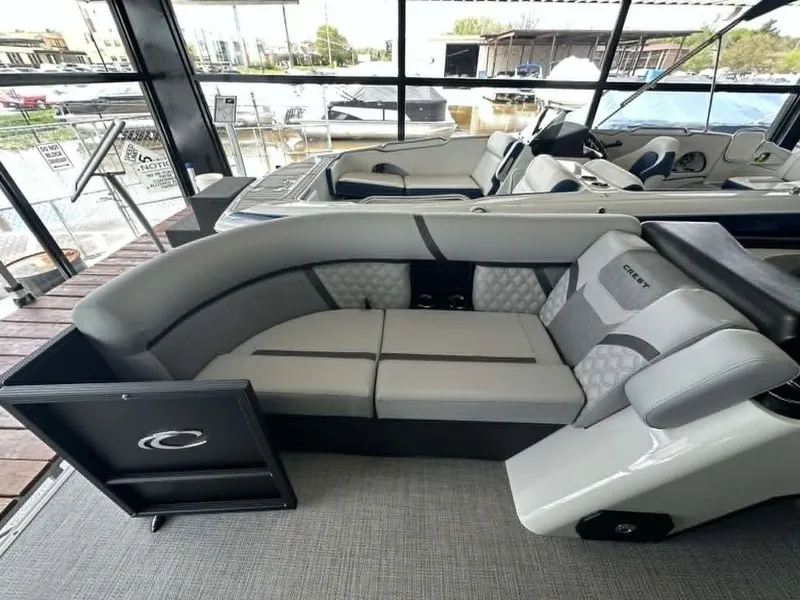 Slide: The Image of Interior of 2026 Crest Conquest 23 FT with gray upholstery. - 5
