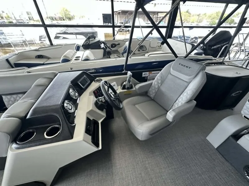 Slide: The Image of Interior of 2026 Crest Conquest 23 FT with helm console. - 8