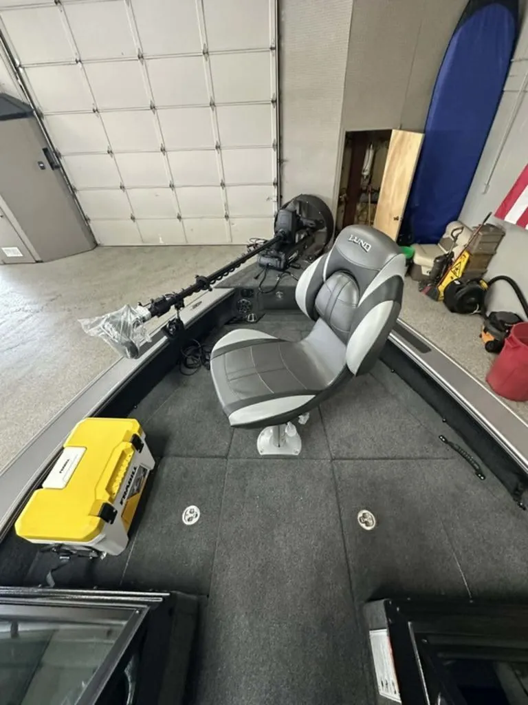 Slide: The Image of Interior of a 2026 Lund 2075 Pro-V Sport boat with seat and equipment. - 3