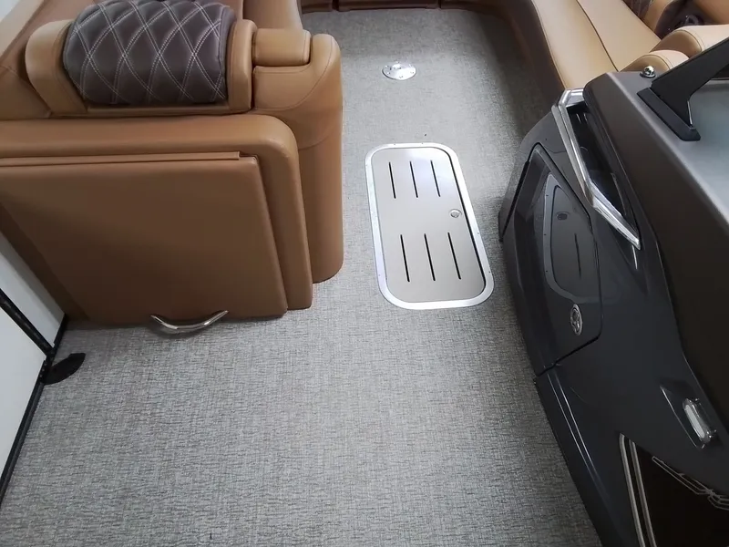 Slide: The Image of Interior of 2026 Bennington 25RSRSF with luxurious seating and carpeted flooring. - 13