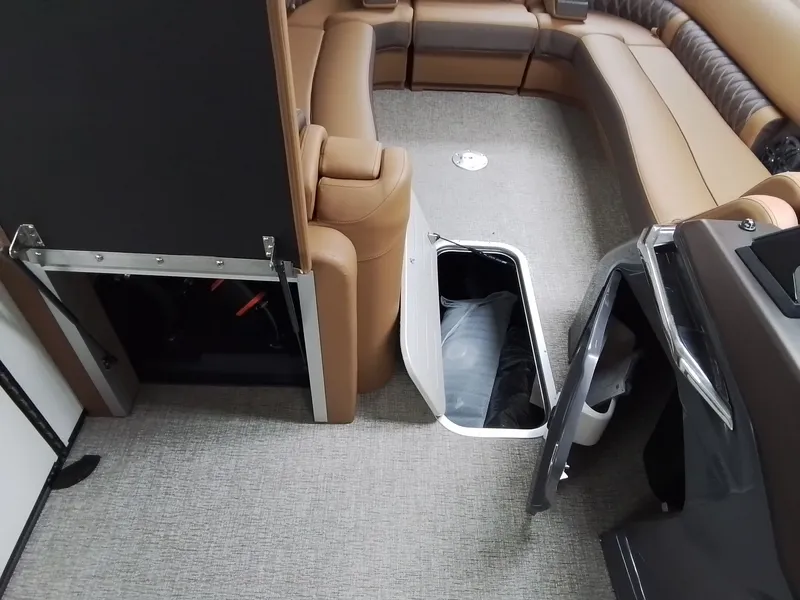 Slide: The Image of Interior of 2026 Bennington 25RSRSF with storage and seating area. - 14