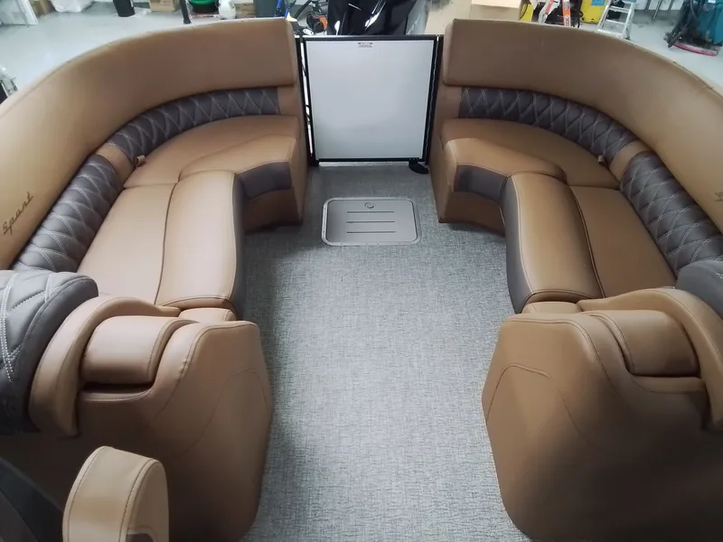 Slide: The Image of Interior of 2026 Bennington 25RSRSF with luxurious leather seating. - 16