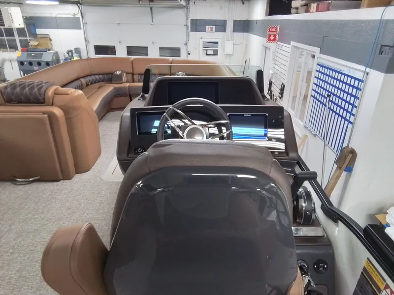 Slide: The Image of Interior of 2026 Bennington 25RSRSF with modern cockpit and leather seating. - 20