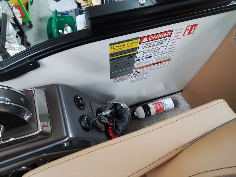 Slide: The Image of Interior view of a 2026 Bennington 25RSRSF with safety labels. - 24
