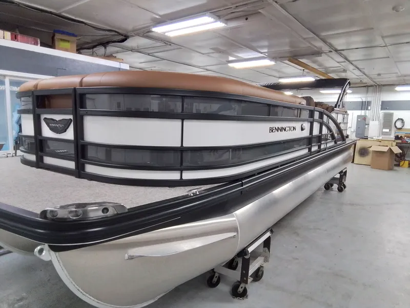 Slide: The Image of Bennington 25RSRSF 2026 pontoon boat in a workshop. - 3