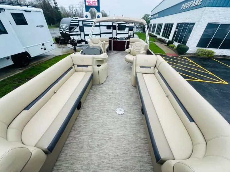 Slide: The Image of Interior view of a 2024 Godfrey Pontoons 2286 SB with beige seating. - 6