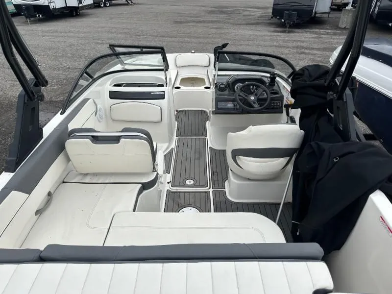 Slide: The Image of Interior of a 2018 Bayliner VR5 boat with steering wheel and seating. - 3