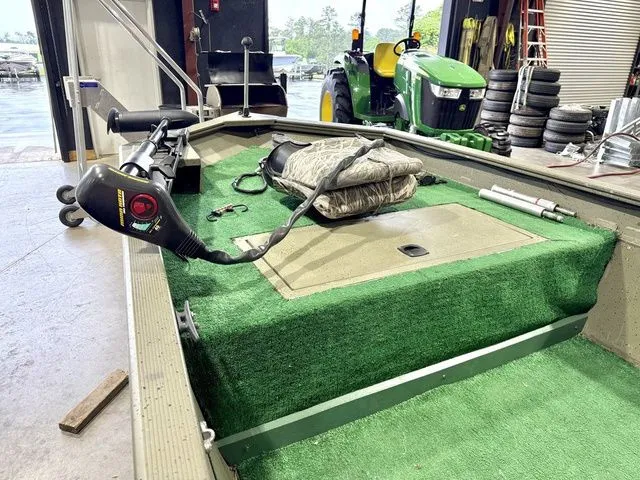 Slide: The Image of Interior of a 2006 Tracker 1654CC boat in a workshop. - 10