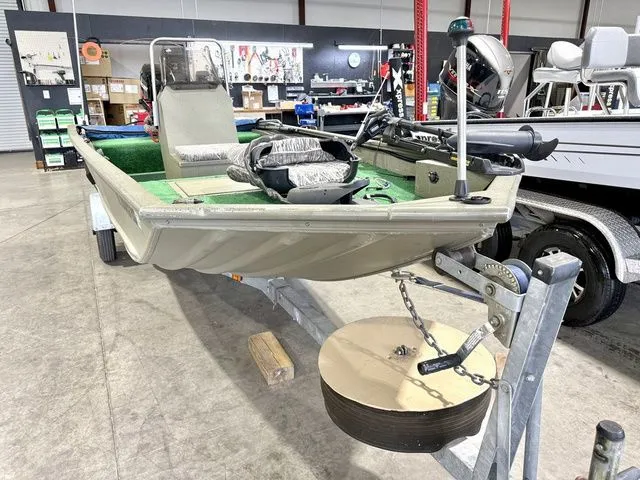 Slide: The Image of 2006 Tracker 1654CC boat on a trailer in a workshop. - 4