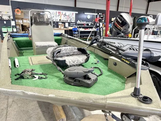 Slide: The Image of 2006 Tracker 1654CC boat in storage with fishing gear. - 5
