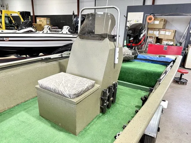 Slide: The Image of 2006 Tracker 1654CC boat with green carpet and bench seat. - 7