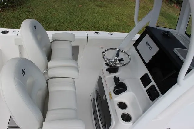 Slide: The Image of Interior view of Sea Pro 245 FLXR Sandbar 2026 with helm console. - 13