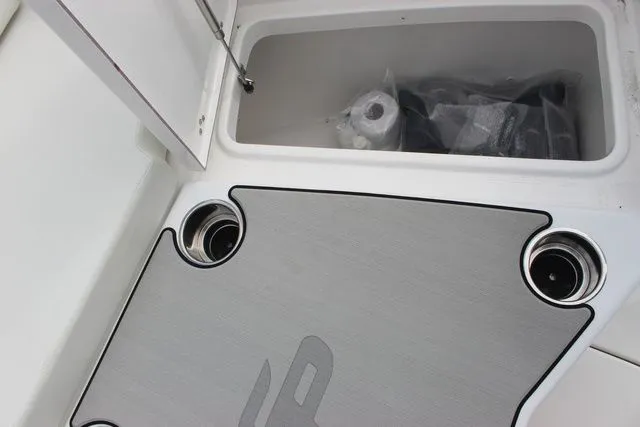 Slide: The Image of Interior of Sea Pro 245 FLXR Sandbar 2026 with storage and cup holders. - 21