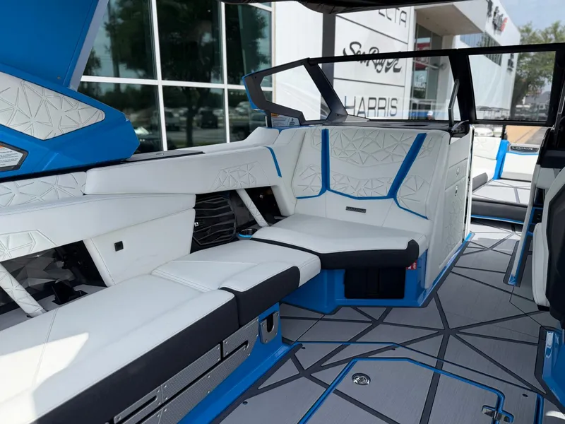 Slide: The Image of Interior of 2026 Nautique Super Air Nautique G25 Paragon with luxurious white seating. - 16
