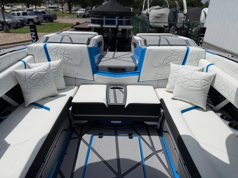 Slide: The Image of Interior of 2026 Nautique Super Air Nautique G25 Paragon with luxurious white seating. - 17
