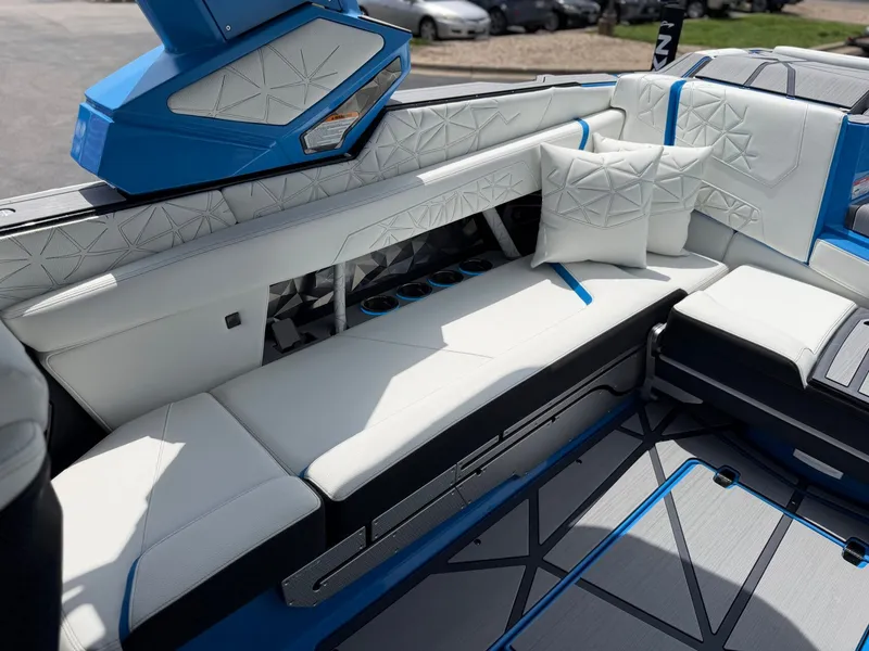 Slide: The Image of Interior of 2026 Nautique Super Air Nautique G25 Paragon with luxurious white seating. - 18
