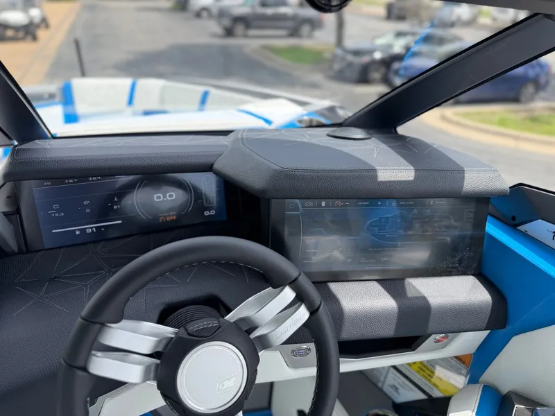 Slide: The Image of Interior of 2026 Nautique Super Air Nautique G25 Paragon with modern displays. - 22