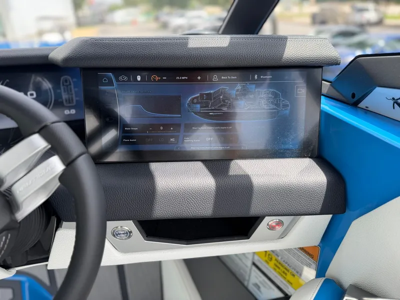 Slide: The Image of 2026 Nautique Super Air G25 Paragon dashboard with touchscreen display. - 23