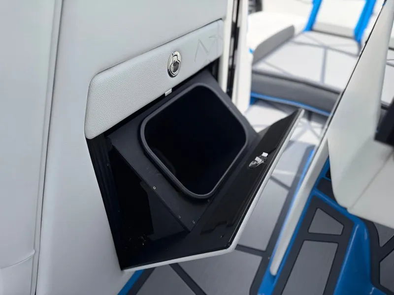 Slide: The Image of 2026 Nautique Super Air G25 Paragon storage compartment detail. - 26