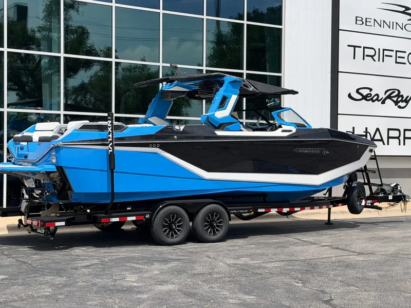 Slide: The Image of 2026 Nautique Super Air Nautique G25 Paragon in blue outside a building. - 3
