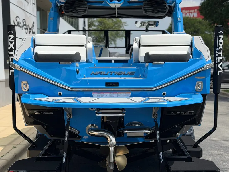 Slide: The Image of Rear view of blue 2026 Nautique Super Air Nautique G25 Paragon boat. - 4