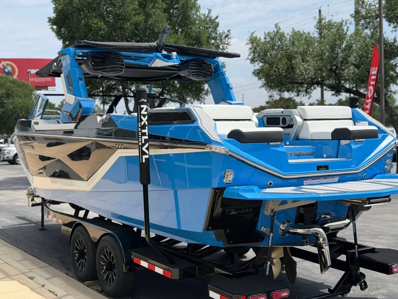 Slide: The Image of 2026 Nautique Super Air Nautique G25 Paragon in blue on trailer. - 5