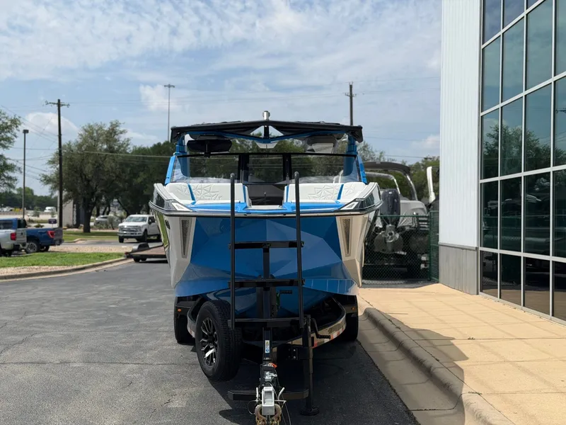 Slide: The Image of 2026 Nautique Super Air Nautique G25 Paragon on trailer outside building. - 7