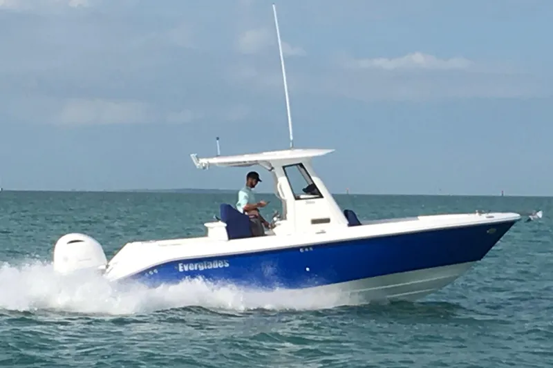 The Image of 2017 Everglades 255 Center Console boat cruising on open water. - 0