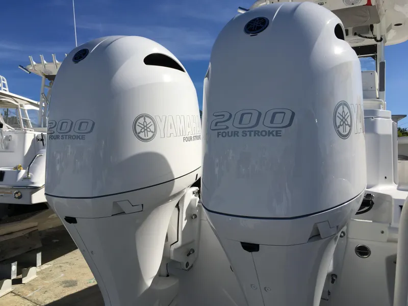 Slide: The Image of Two Yamaha 200 HP outboard engines on an Everglades 255 Center Console boat. - 12