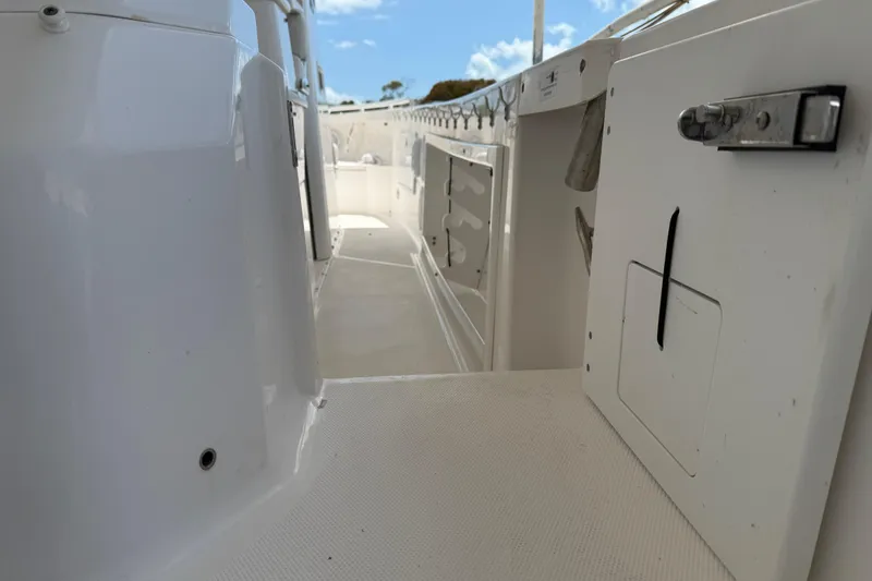 Slide: The Image of 2017 Everglades 255 Center Console boat interior with storage compartments and sleek design. - 16
