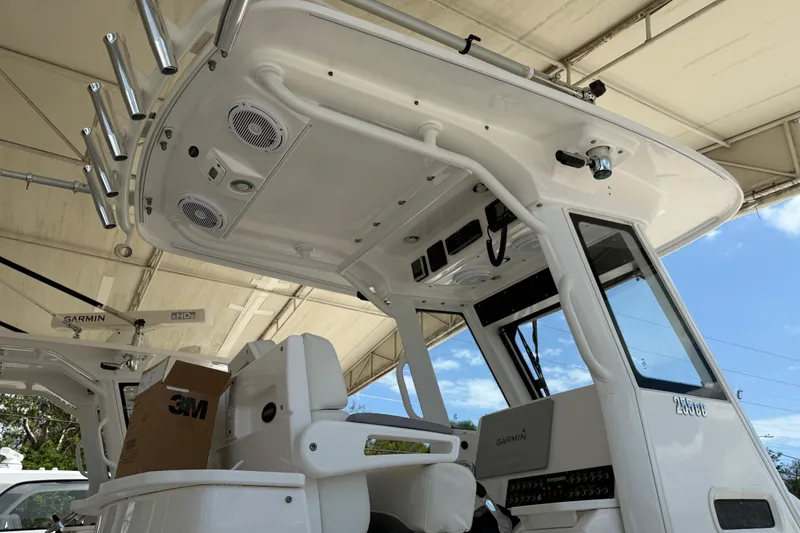 Slide: The Image of 2017 Everglades 255 Center Console boat interior with Garmin electronics and rod holders. - 17