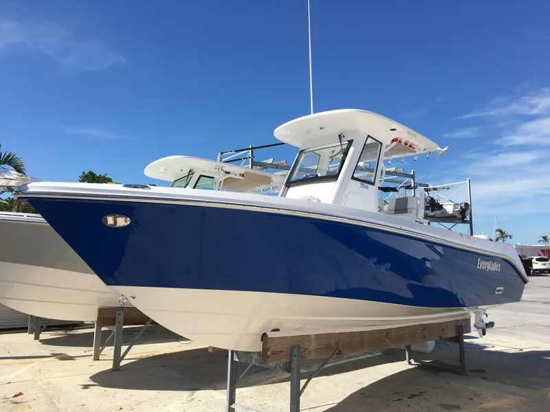 Slide: The Image of 2017 Everglades 255 Center Console boat on a dock. - 3