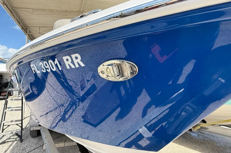 Slide: The Image of 2017 Everglades 255 Center Console boat with blue hull and registration number FL 3901 RR. - 4