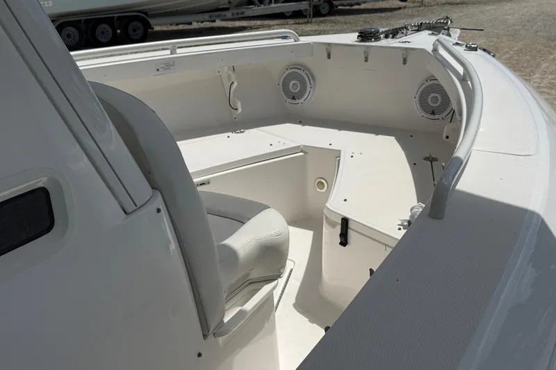 Slide: The Image of 2017 Everglades 255 Center Console boat interior with seating and speakers. - 8