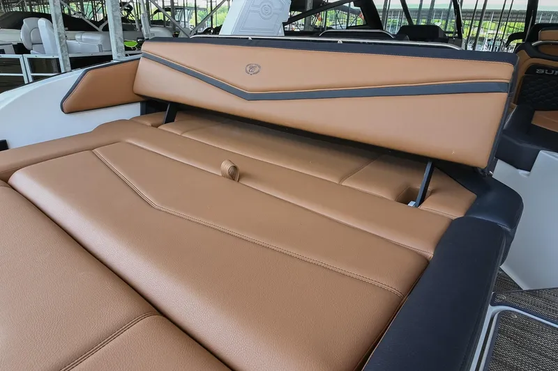 Slide: The Image of 2022 Cobalt R6 Surf boat interior with luxurious tan leather seating. - 10