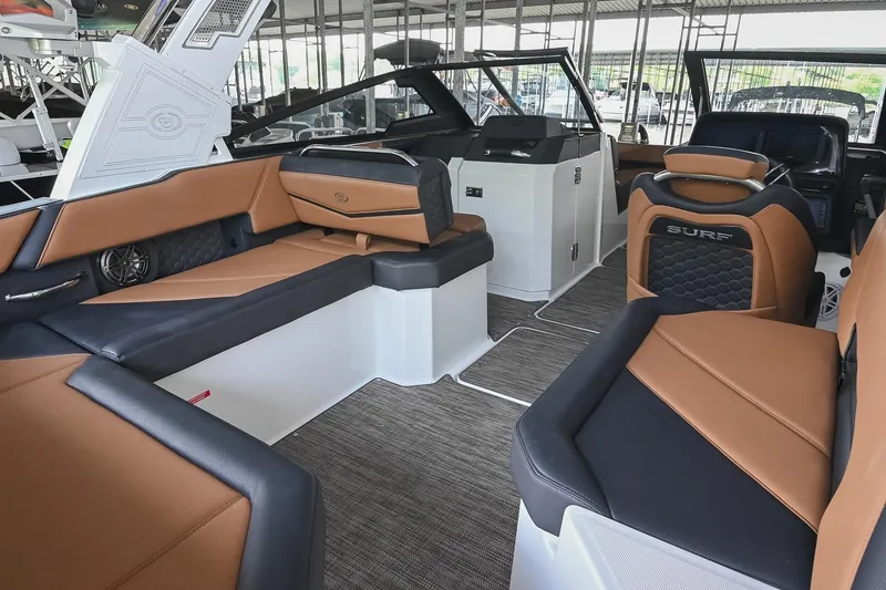 Slide: The Image of 2022 Cobalt R6 Surf boat interior with luxurious seating and modern design. - 13