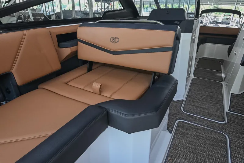Slide: The Image of Luxurious interior of 2022 Cobalt R6 Surf boat with tan leather seating. - 20