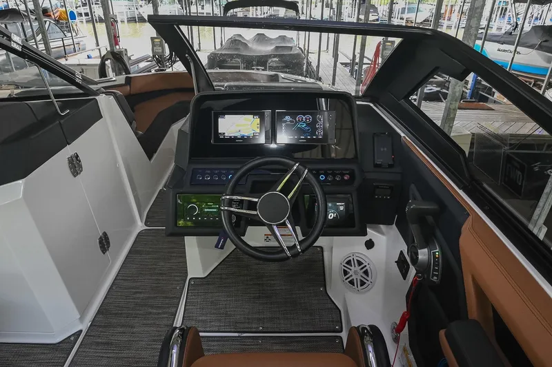 Slide: The Image of 2022 Cobalt R6 Surf boat cockpit with modern navigation and control systems. - 24
