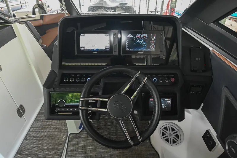 Slide: The Image of Cockpit of 2022 Cobalt R6 Surf boat with modern navigation displays and controls. - 25
