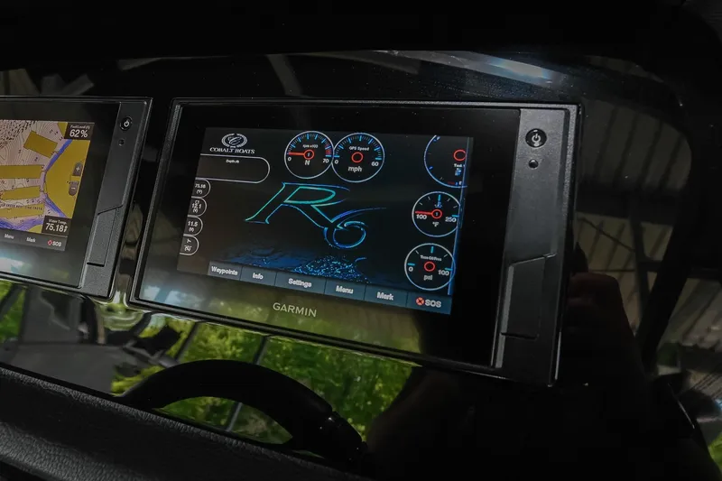 Slide: The Image of Dashboard of 2022 Cobalt R6 Surf boat with Garmin navigation display. - 26