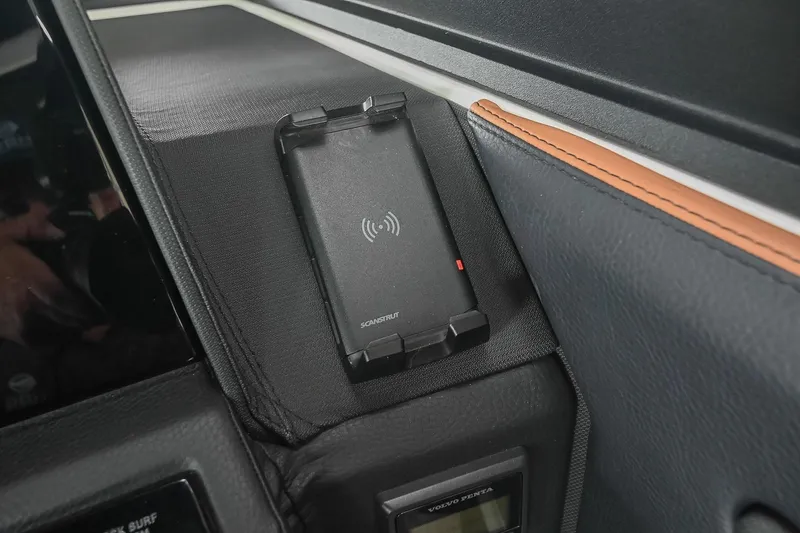 Slide: The Image of Wireless charging pad in 2022 Cobalt R6 Surf boat interior. - 30