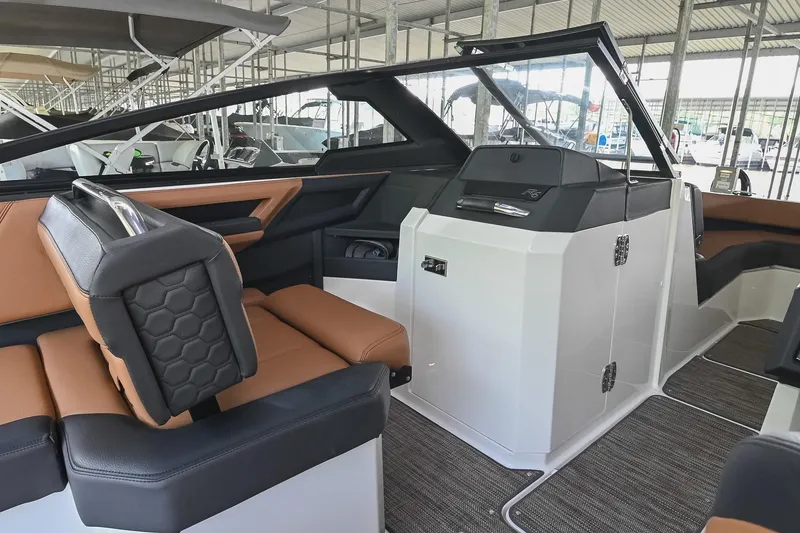 Slide: The Image of 2022 Cobalt R6 Surf boat interior with luxurious seating and modern dashboard design. - 33