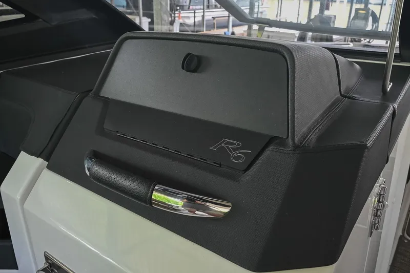 Slide: The Image of 2022 Cobalt R6 Surf boat dashboard with sleek black design and chrome accents. - 35