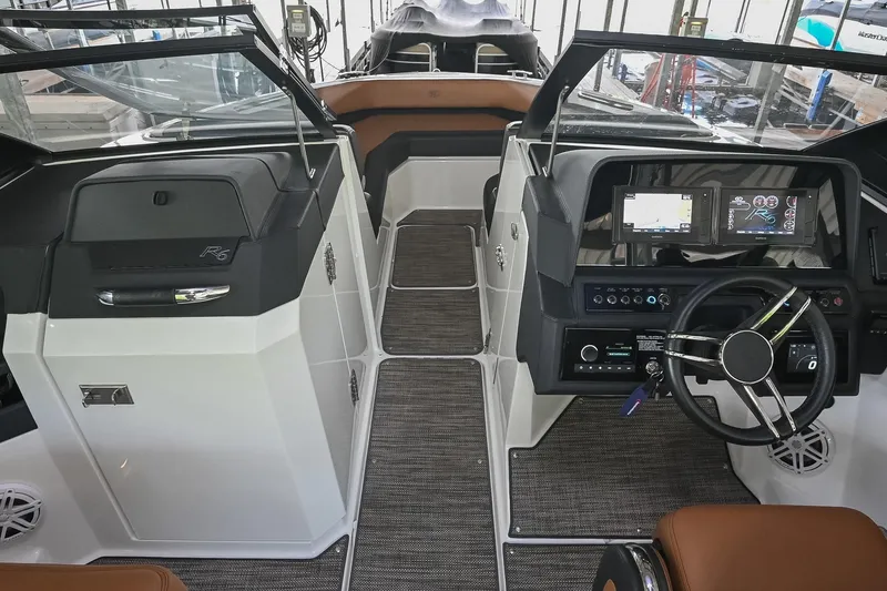 Slide: The Image of 2022 Cobalt R6 Surf boat interior with modern dashboard and steering wheel. - 37