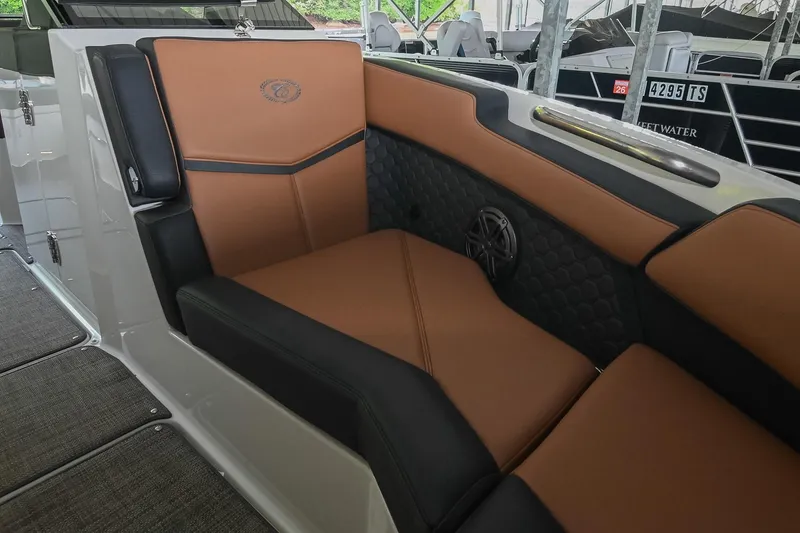 Slide: The Image of Luxurious seating in 2022 Cobalt R6 Surf boat with brown and black upholstery. - 40